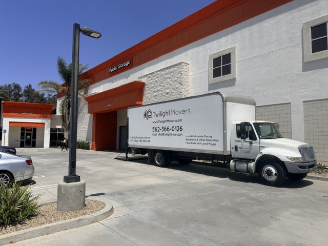 Twilight Movers crew loading a moving truck in a Long Beach neighborhood