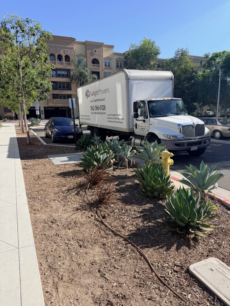 Twilight Movers moving truck parked at an apartment property for a local residential move