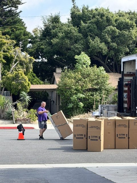 Twilight Movers crew using wardrobe moving boxes during a professional residential move